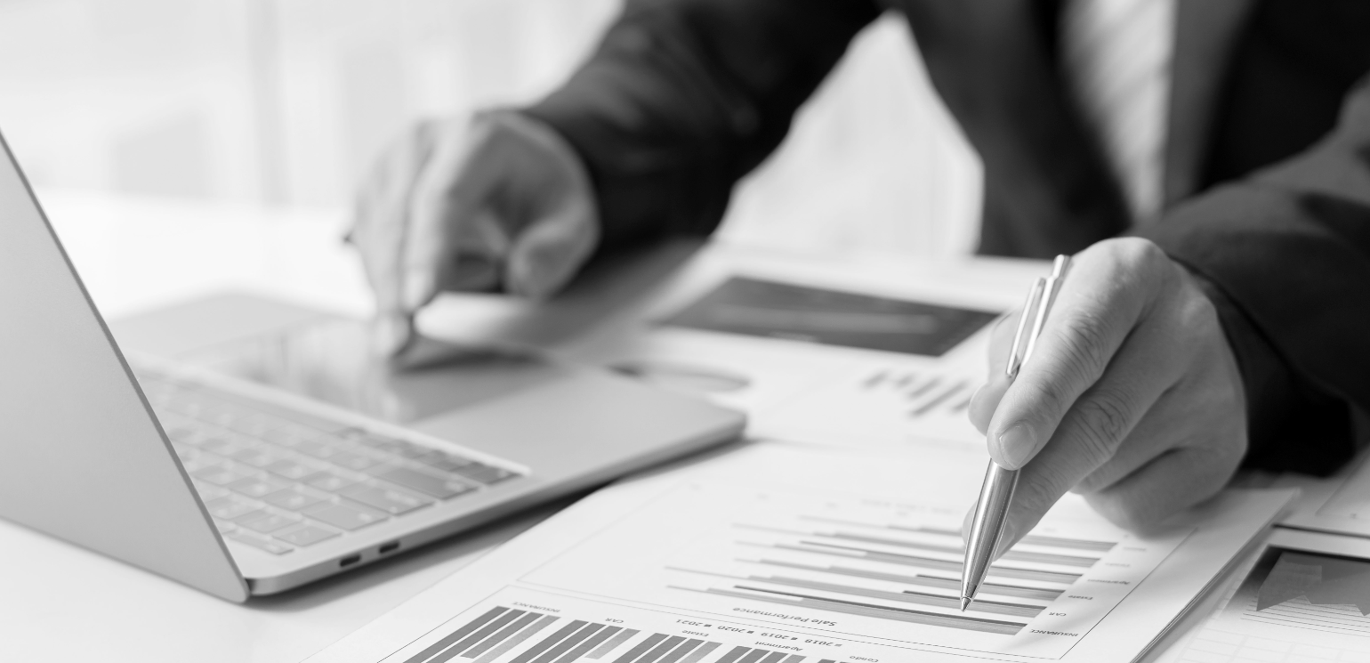 Business man working with laptop computer and business documents